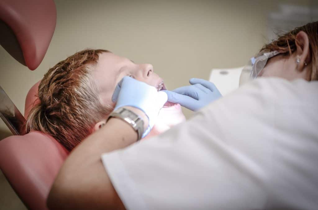 boy in dentists chair successful dentist visit