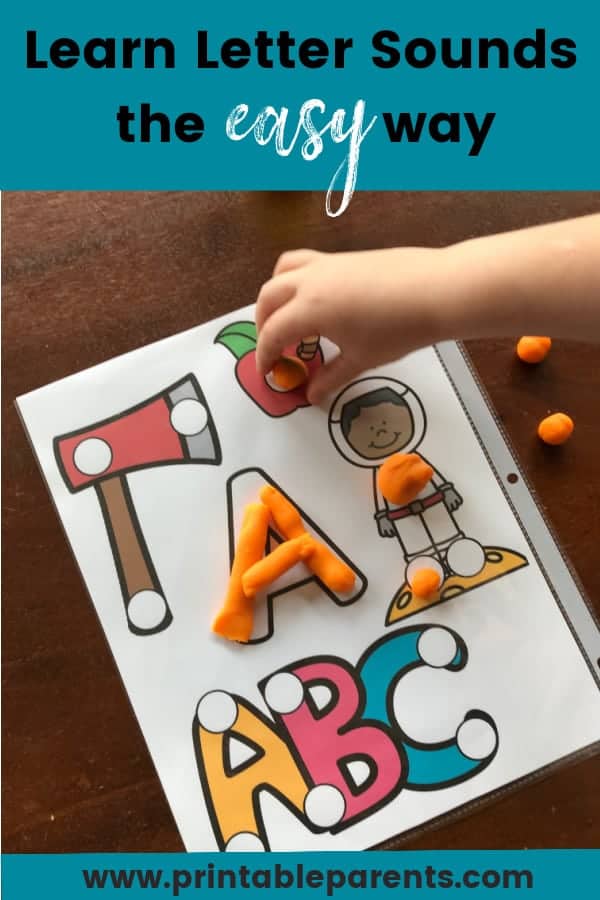 pin image of a child placing play doh on a letter A printables