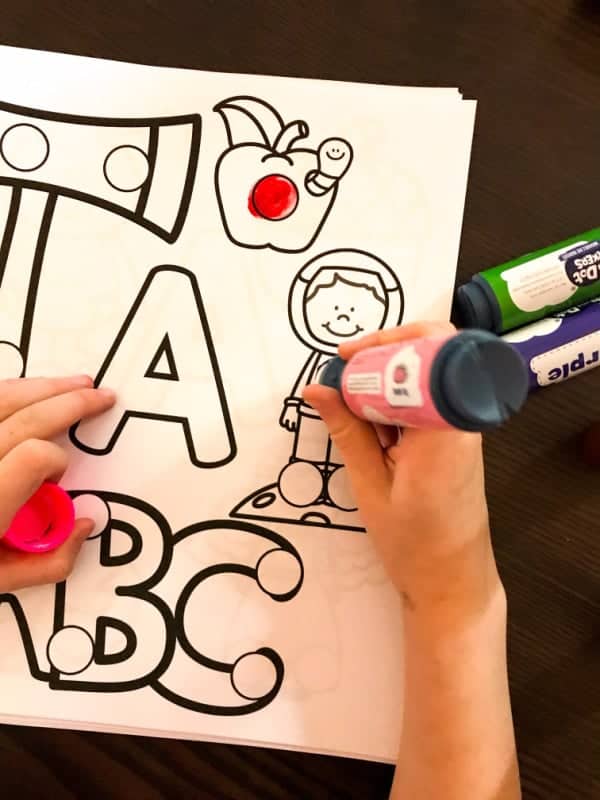 child with dot marker beginning sound worksheet for letter A