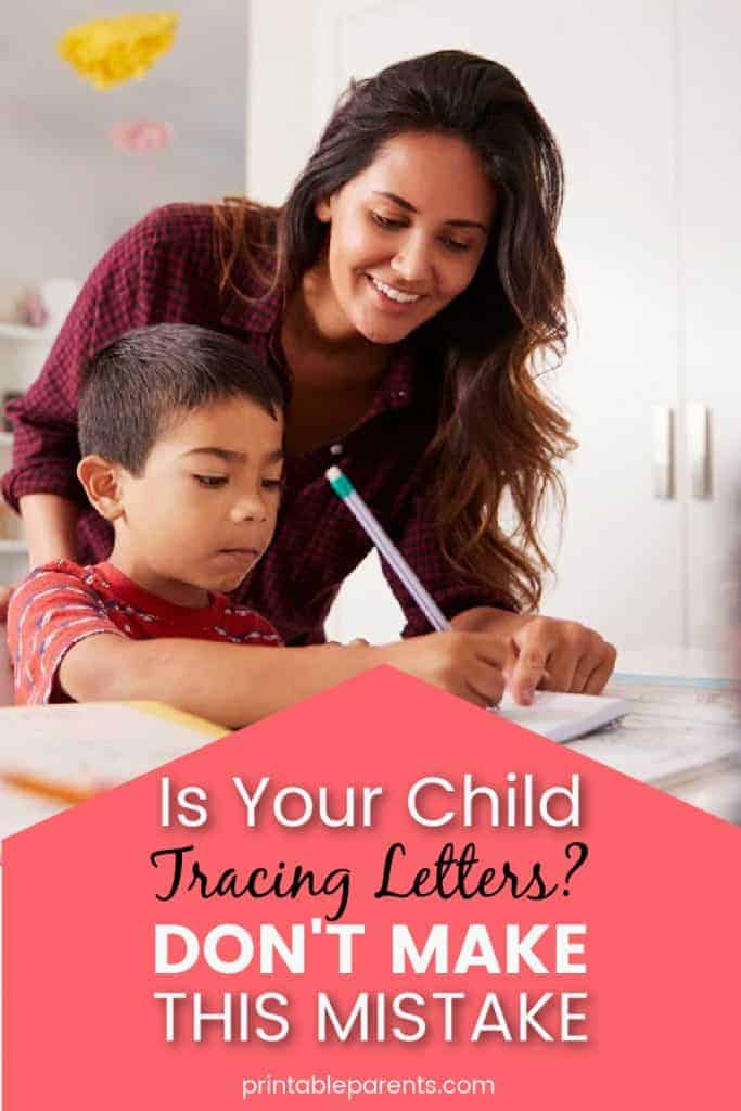 pinterest image of mother helping her son write with the title on a pink triangle Is You Child Tracing Letters? Don't make this mistake